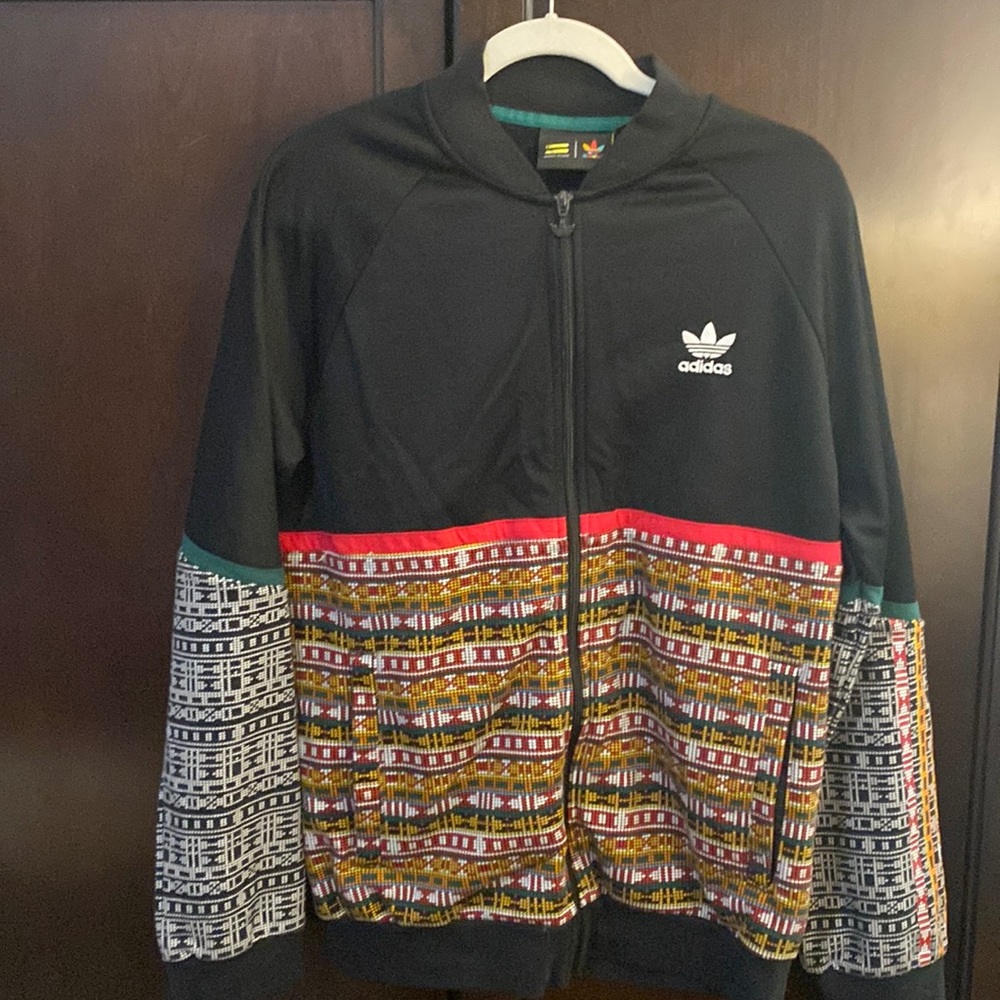 Preloved Pharrell X Adidas track jacket size medium.